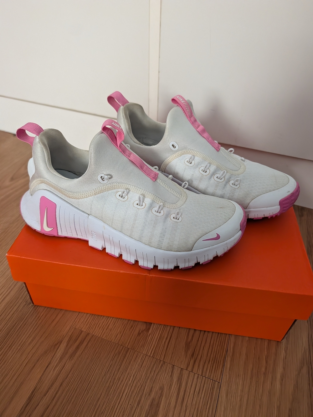 Nike Women’s White and Pink Slip-On Athletic Sneakers